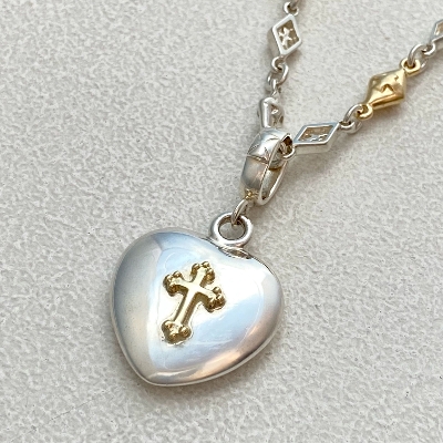 ROUND HEART PENDANT WITH GOLD CROSS 